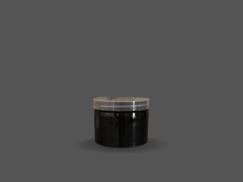 Black plastic cream jar